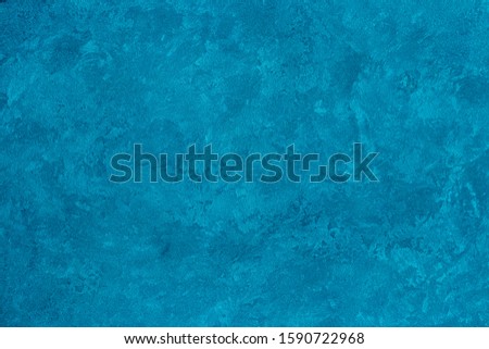 Texture of blue decorative plaster or stucco. Abstract background for design. Art stylized banner with copy space for text. 
