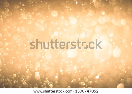 Abstract bokeh lights with light Orange background
