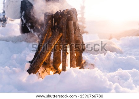 Bonfire at sunset in winter