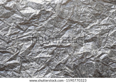 Flat lay, Close-up texture of Crumpled grey paper background abstract. Detail texture of pattern with free space copy for text.