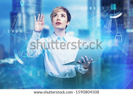 Young Asian businesswoman with laptop using immersive big data interface in blurry city. Concept of computer science and communication. Toned image double exposure