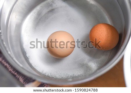 Boiled eggs in water with salt
