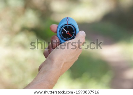 close up of a compass in the hand
