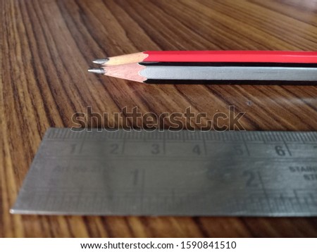 Two pencil with scale and rubber, for geometry. a beautiful background for education website.