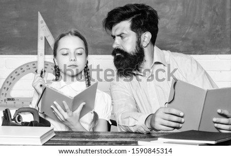 back to school. math geometry. education and knowledge. biology chemistry lesson. father and daughter study in classroom. bearded man teacher with small girl in classroom. Geometry favorite subject.