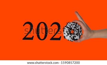 new year 2020 with a donut instead of zero on a red lava background, follow a diet and watch your health in the new year. the opportunity to change your life and make it healthy.