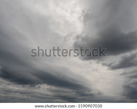 Dramatic dark storm sly clouds abstract background.