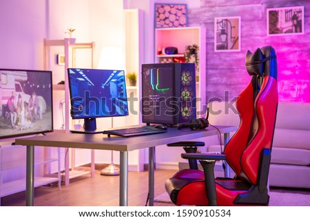 Empty room with a pc for online gaming and gaming chair.