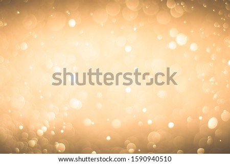 Abstract bokeh lights with light Orange background
