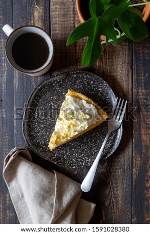 Lemon pie with meringue on a wooden background. Tart. Bakery products. Dessert. Homemade food.