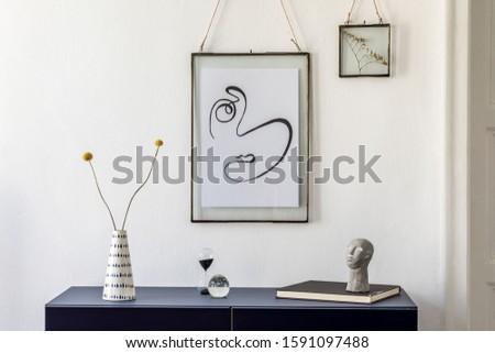 Stylish scandinavian interior design with mock up picture frames, navy blue commode, flowers in vase, books and elegant accessories. Modern home decor. Living room. Template Ready to use. 