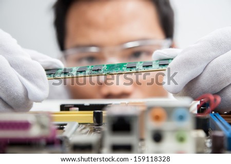 Expert engineers examining computer equipment. Royalty-Free Stock Photo #159118328