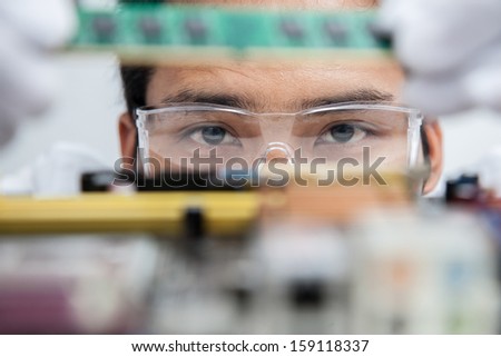 Expert engineers examining computer equipment. Royalty-Free Stock Photo #159118337