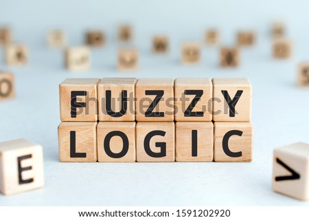 Fuzzy logic - phrase from wooden blocks with letters fuzzy logic concept, random letters around, white  background