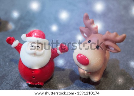 Christmas holiday composition, close up santa claus and reindeer with white snow
