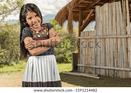 Candid portrait of girl in front of her countryside home
Very cute Mexican little girl portrait