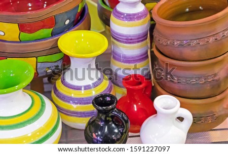 Decorative ceramic vases and miniature jugs.