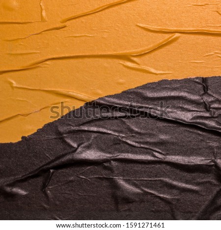 Empty crumpled and wet texture paper. Creased grunge paper background. Art rough stylized blank for a billboard, poster or banner with space for text. Copy space. Collage of yellow and black.