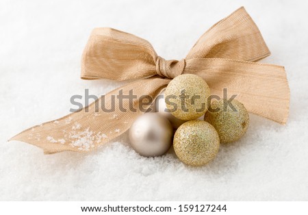 Gold Christmas baubles and ribbon