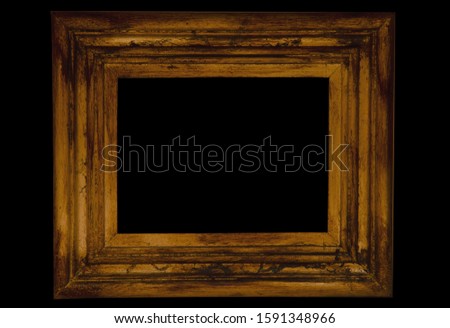 Gilded vintage rectangular frame close-up. Isolated object on a black background.