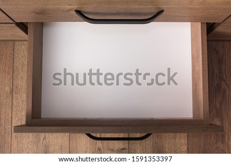 Top view of empty open wooden drawer Royalty-Free Stock Photo #1591353397