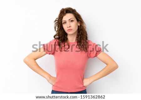 Young pretty woman over isolated background angry