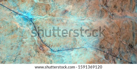 the artificial river, abstract photography of the deserts of Africa from the air. aerial view of desert landscapes, Genre: Abstract Naturalism, from the abstract to the figurative, contemporary photo