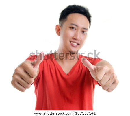 Thumb up cool young Southeast Asian man isolated over white background