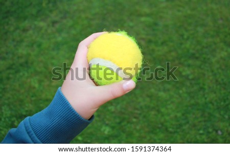 children's game - balls Velcro. children's hand holding Velcro play ball