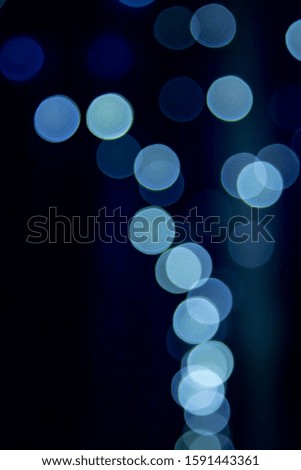 dark background with blue bokeh with a copyspace