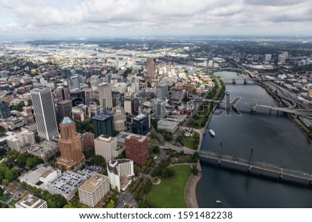 Aerial view of the Williamette River, buildings, bridges and streets in downtown Portland, Oregon, USA.