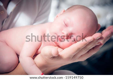 Newborn baby sleeping on the shoulder of his father Royalty-Free Stock Photo #159149750