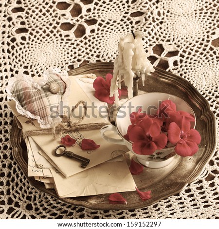 vintage background of old mail with keys on a silver plate
