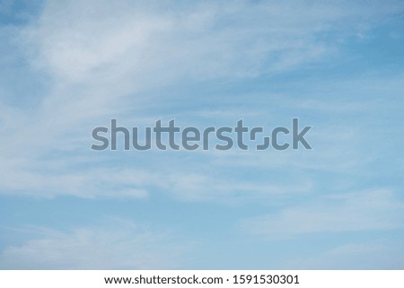 Background sky. Blue sky with clouds overhead. Sky close up. Look into the peaceful sky