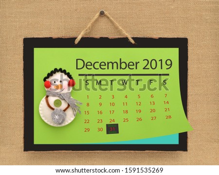 Kwanzaa (Kuumba means Creativity) December 2019 Calendar Page hanging on canvas background