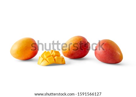 Food photography of mangoes with one hedgehog cut cheek on a white background