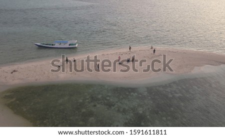 Aerial photo of Salarangan island in Kangean islands east java indonesia, magic sands beach. white sands beach, blue sea, small island, hidden paradise