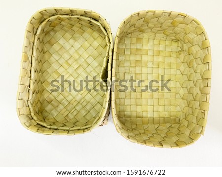 Traditional woven palm leaves isolated on white background
