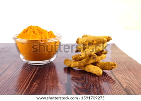 Turmeric on bowl Isolated in brown