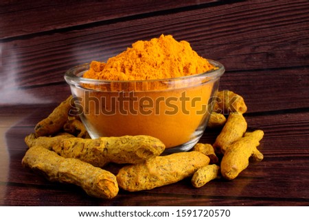 Turmeric on bowl Isolated in brown