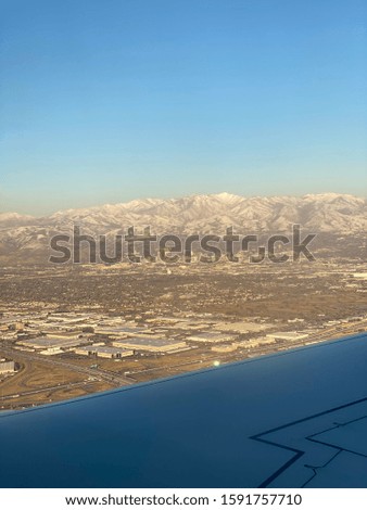 Aerial view of Salt Lake City from airplane over the wing