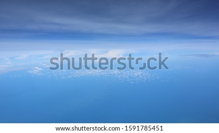 Fantastic background with clouds, view from airplane window.