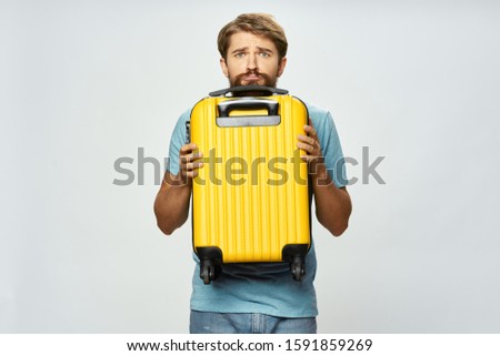 Male traveler yellow suitcase airport flight on vacation