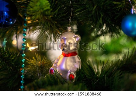 
Glass toy bear on christmas tree