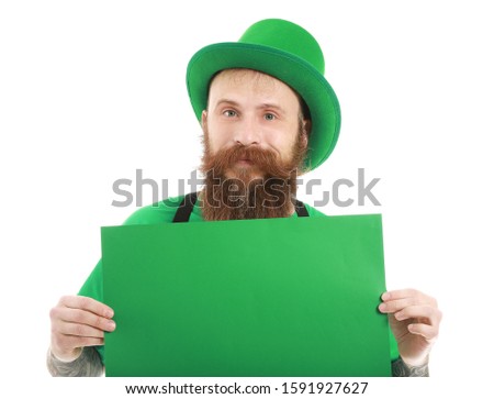 Bearded man with blank poster on white background. St. Patrick's Day celebration