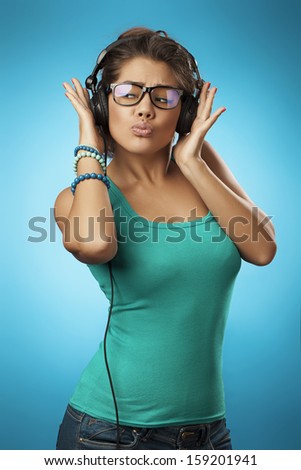 woman with headphones listening music .Music teenager girl dancing against 
