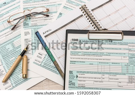 1040 individual us tax form with pen.