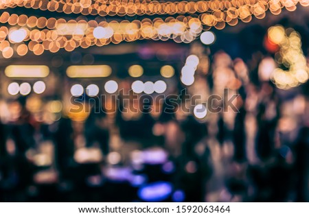 Vintage tone abstract blurred image of Street  night festival with light bokeh  for background usage.