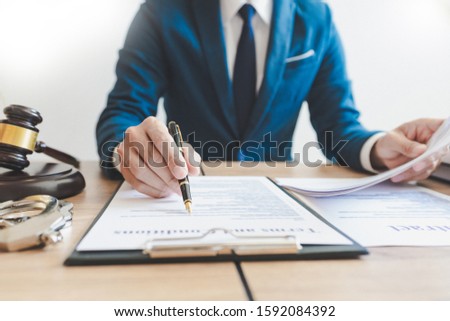 The private office workplace for consultant an young lawyer legislation with gavel and document on wood table