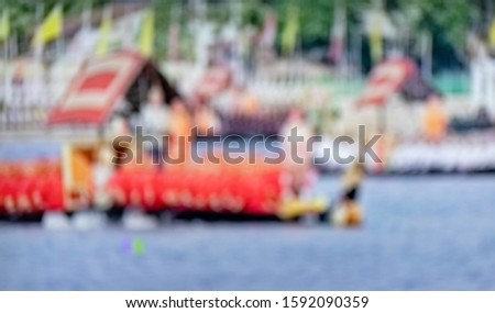 The blurry colorfull boat and river.